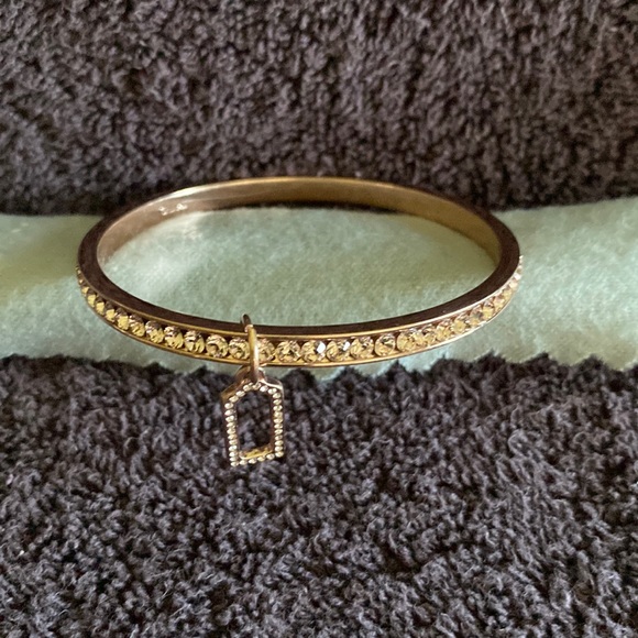 Coach rose gold bangle with charm